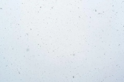 Snowfall texture snowflakes on blurred background weather design Stock Photos