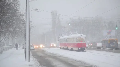 Snowfall. trams move around the city in winter. Kiev Stock Footage 83771889