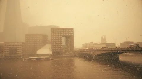 Snowfall. View of the bridge on the River Thames. Snowy London. Stock Footage 86617293