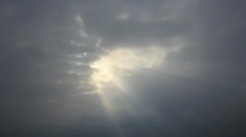 Snowfall view in sunbeams clouds hole Stock Footage 34760509