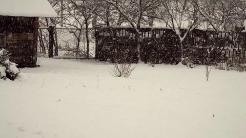 Snowfall in the village Stock Footage 83456150