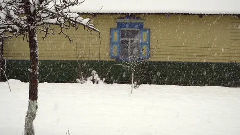 Snowfall in the village Stock Footage 83456254