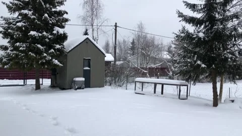 Snowfall in the village Stock Footage 327932442