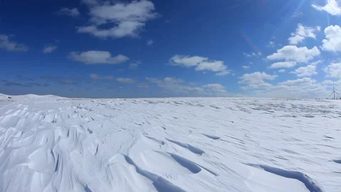 Snowfield Wind Patterns and Sunbeams Stock Footage 324960780