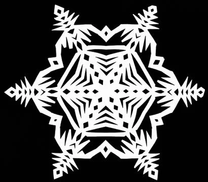 Snowflake on black paper Stock Photos