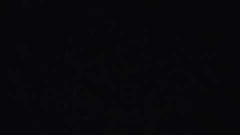 Snowflake effect motion on black background Stock Footage 246138116