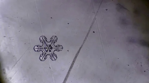 Snowflake forms a drop of water Stock Footage 72785764