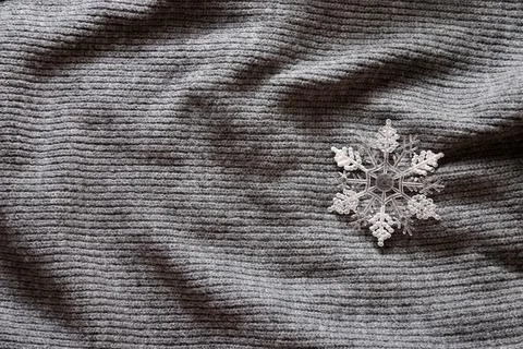 Snowflake on a gray background Stock Photos