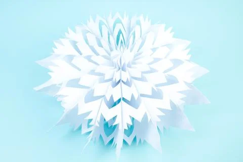 Snowflake made of paper on white background. voluminous. Stock Photos