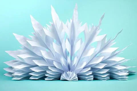 Snowflake made of paper on white background. voluminous. Stock Photos