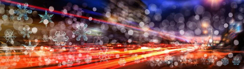Snowflake New Year winter pattern on blurred defocused background of car nigh Stock Photos