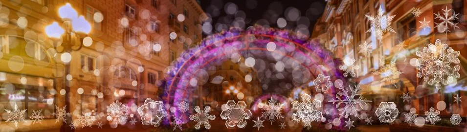Snowflake New Year winter pattern on blurred defocused background of night Ar Stock Photos