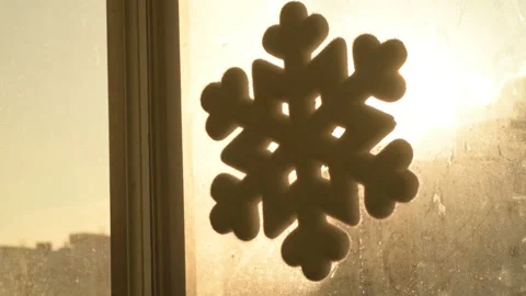 Snowflake shape figure frozen on window in winter Stock Footage 147035713