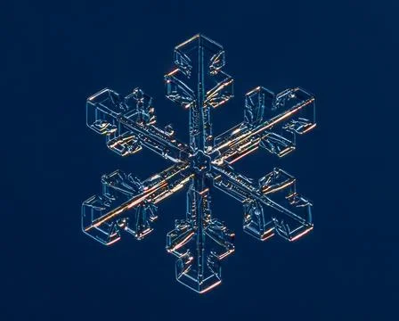 Snowflake on smooth gradient background. Macro photo of real snow crystal on 스톡 사진