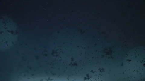 Snowflakes on airplane window with bokeh background Видео 142189510
