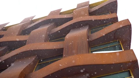 Snowflakes are falling on the background of a modern building Stock Footage 267190556