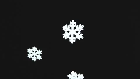 Snowflakes are falling on a black background. Christmas decorations Stock Footage 144876316