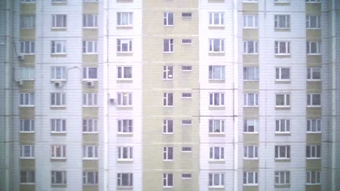 Snowflakes on the background of the house opposite. Video stock 85689154
