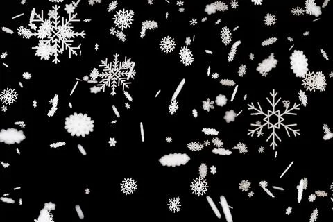 Snowflakes drift down against a black background in a three-dimensional rep.. Ilustración de archivo