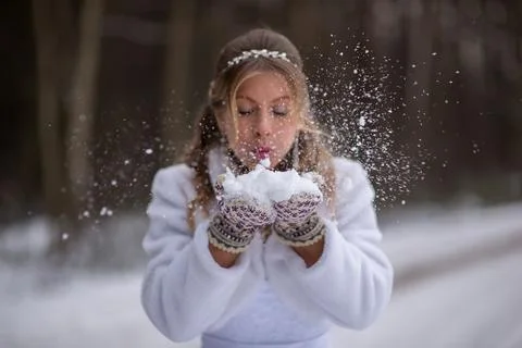 Snowflakes Exploding From Bride Hands Stock Photos