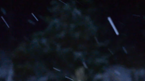 Snowflakes fall at Night Stock Footage 33403667