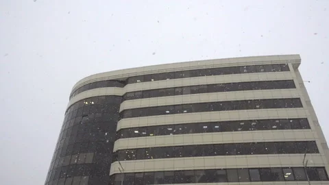 Snowflakes fall in slow motion on a building. Stock Footage 166161932
