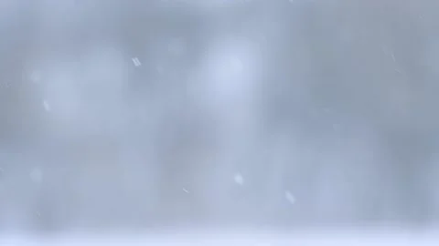 Snowflakes fall in winter in slow motion from Bokeh, a fascinating video with Stock Footage 159792357