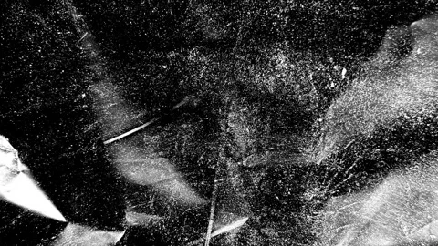 Snowflakes falling against a dark night sky Stock Footage 346559576