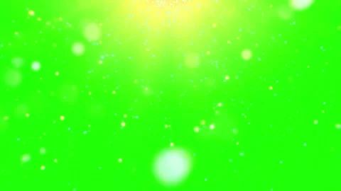 Snowflakes falling on green background with yellow glow Video stock 337924193