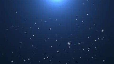 Snowflakes falling under bright light Stock Footage 125313971