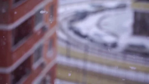 Snowflakes fly in the background of a window on house Video stock 71139010