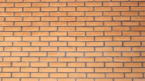 Snowflakes fly on a brick wall background Stock Footage 124633626