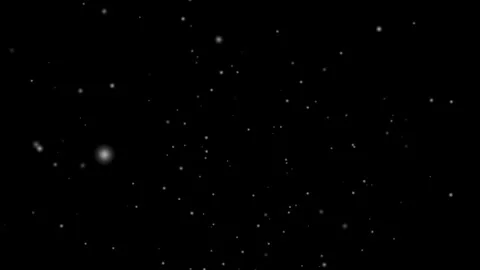 Snowflakes gently falling on a dark background, creating a peaceful winter Stock Footage 285580774