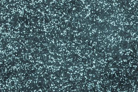 Snowflakes on the ice of dark turquoise color Stock Photos
