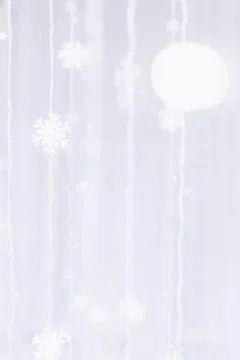 Snowflakes on the strings in the blue space background with blurred abstract Stock Photos