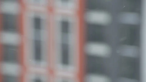 Snowing against building blurred Stock Footage 103112893