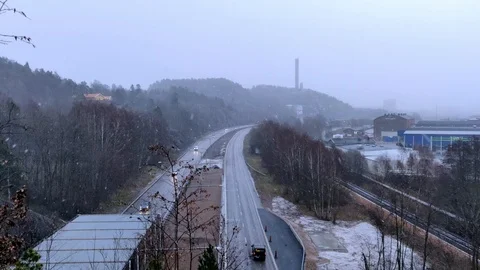 Snowing and Hill View Over Highway Stock Footage 101190545
