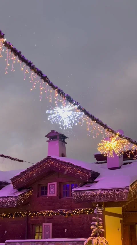 Snowing day with night lights and a traditional chalet in French alps. Stock Footage 336906793