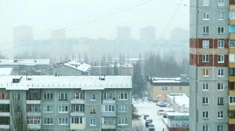 Snowing in the district of multistory buildings Stock Footage 59250396