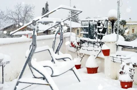 Snowing on the garden Stock Photos