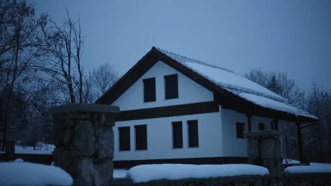 Snowing on mountain house Stock Footage 101664872