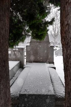 Snowing over the graveyard grave Stock Photos