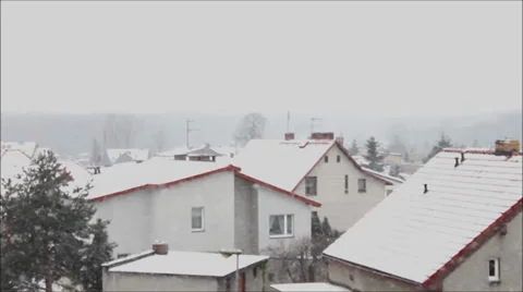 Snowing over residential area Stock Footage 34369516