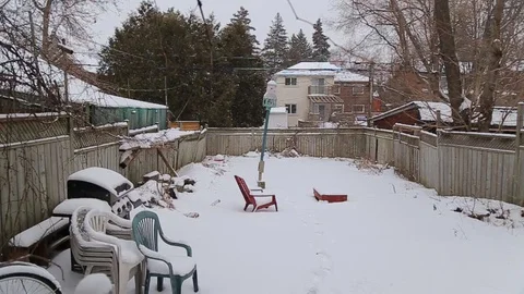 Snowing in patio Stock Footage 128083987