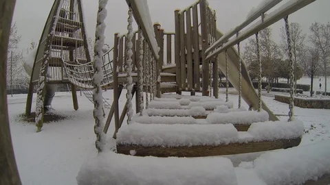 Snowing at the playpen Video stock 103474325
