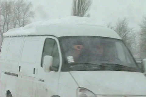 Snowing on road Stock Footage 1100362