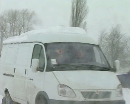Snowing on road Stock Footage 1100364