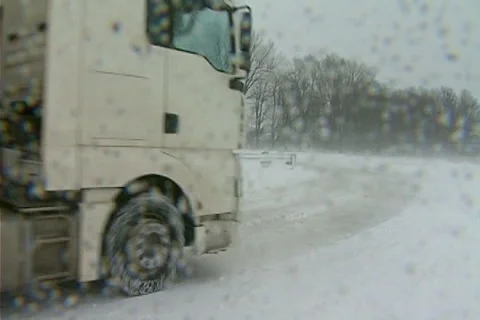 Snowing on road Stock Footage 1100427