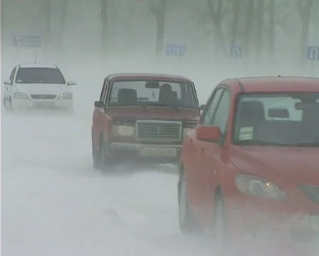 Snowing on road Stock Footage 1100435