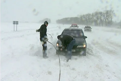 Snowing on road Stock Footage 1100437